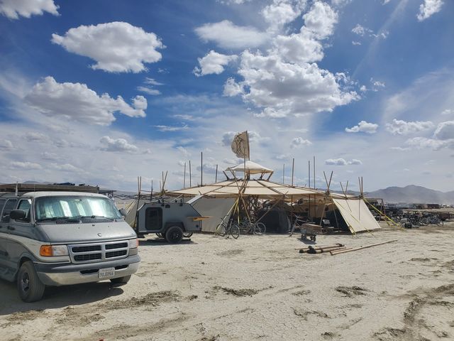 The van and the shade rig along the playa.