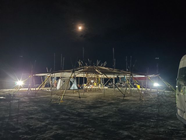 Lit from below with the moon up over it.