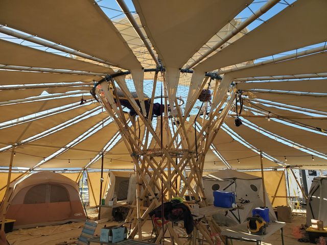 Tents ranged around the central column, the canopy overhead.