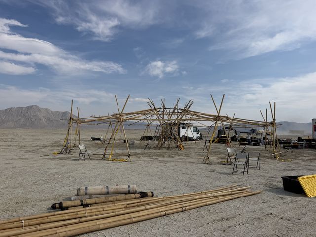 The frame from the other side, mountains behind, culms stacked.