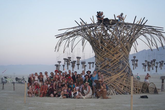 Everyone who built it, in front of it.